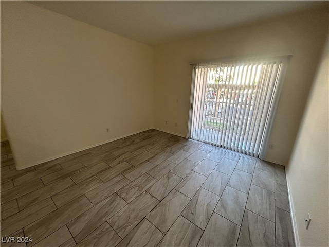 unfurnished room with light hardwood / wood-style floors