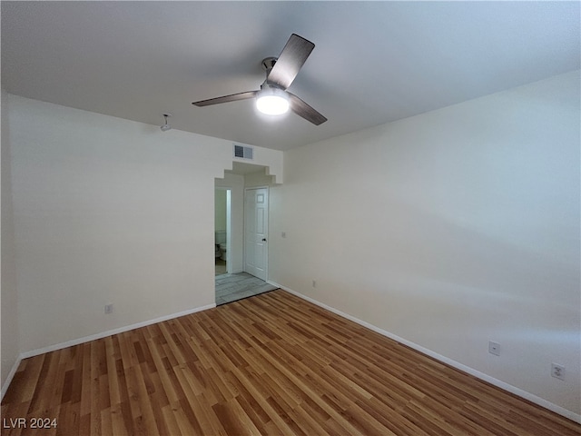 spare room featuring light wood-type flooring and ceiling fan