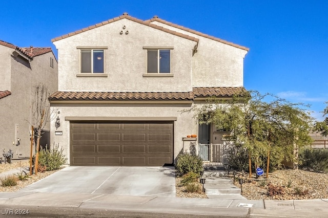 mediterranean / spanish-style home featuring a garage