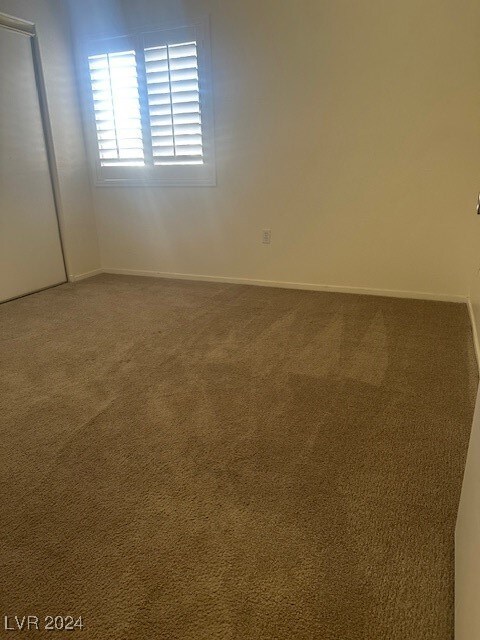 empty room featuring carpet flooring