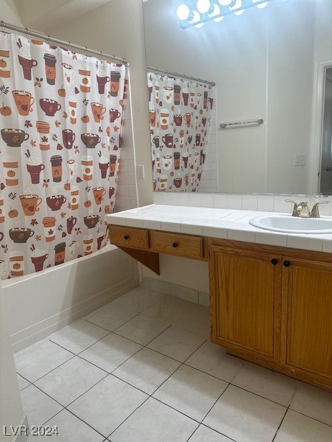 bathroom featuring vanity, tile patterned flooring, and shower / bath combo