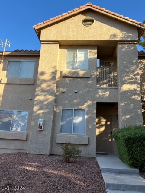 view of front of home with a balcony