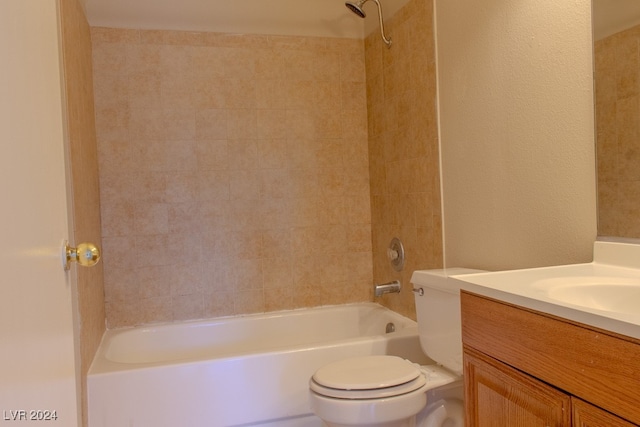 full bathroom with vanity, toilet, and tiled shower / bath combo