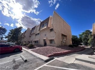 1303 Darlene Way Unit 405B, Boulder City, NV 89005 - view of building exterior with uncovered parking