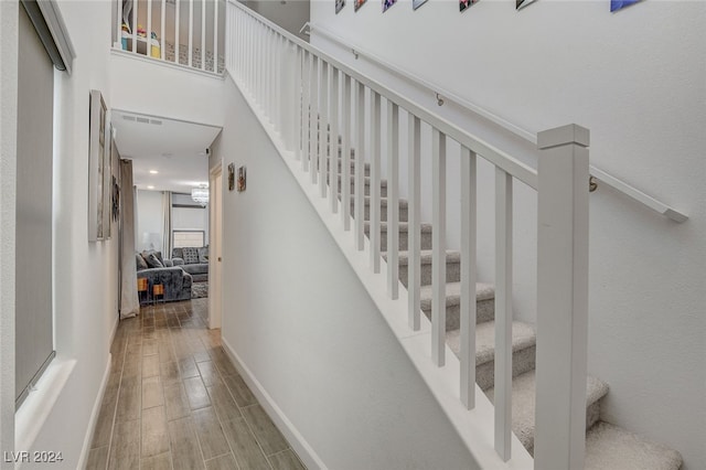 staircase featuring hardwood / wood-style floors