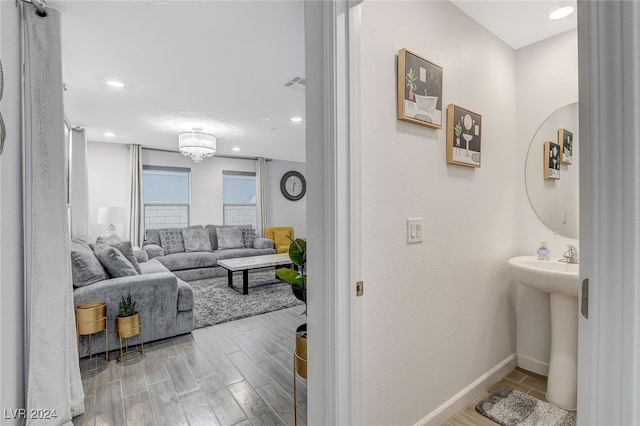 bathroom featuring sink and hardwood / wood-style flooring