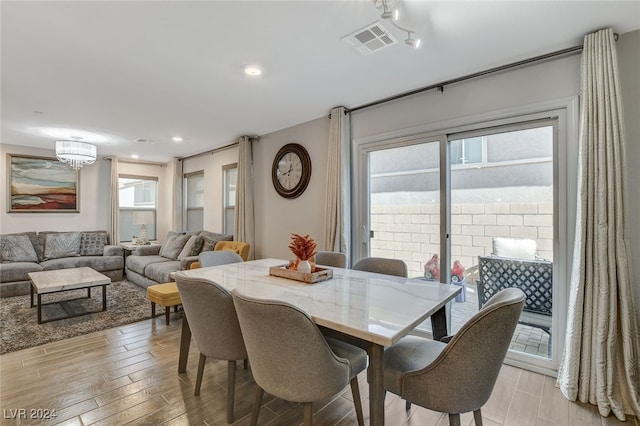 dining area with light wood-type flooring