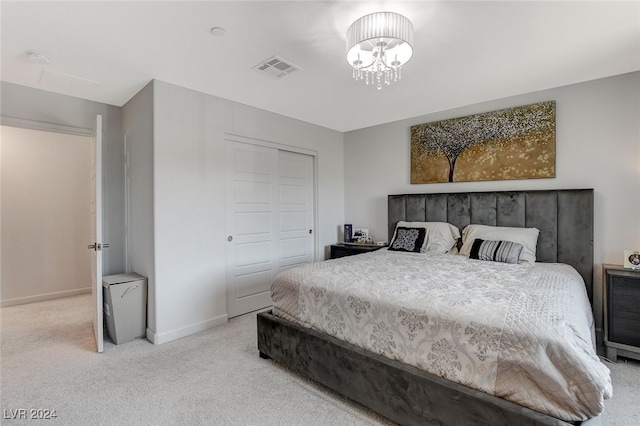 carpeted bedroom featuring a closet