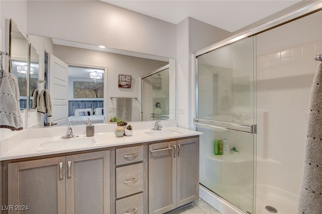 bathroom featuring vanity, tile patterned floors, and an enclosed shower