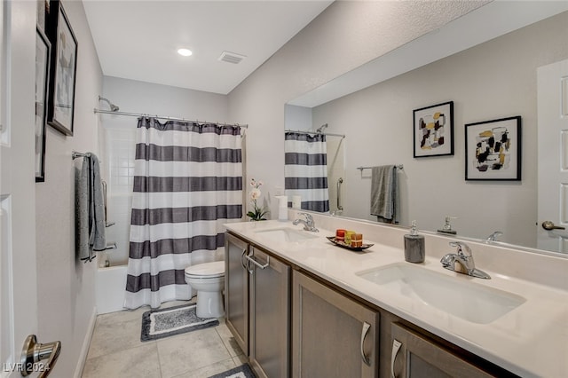 full bathroom with shower / bath combo, vanity, toilet, and tile patterned floors