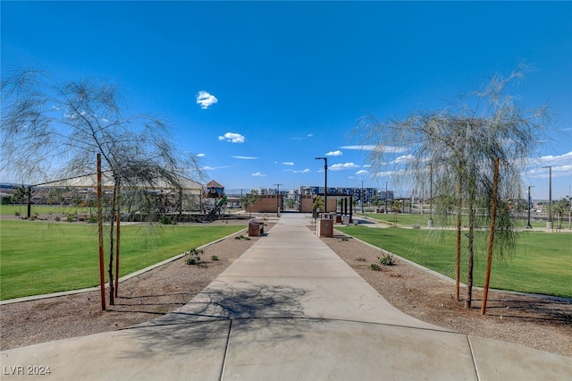 view of property's community featuring a yard