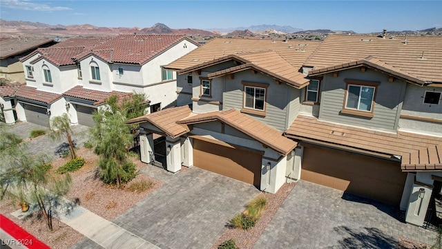 view of front of house featuring a garage and a mountain view