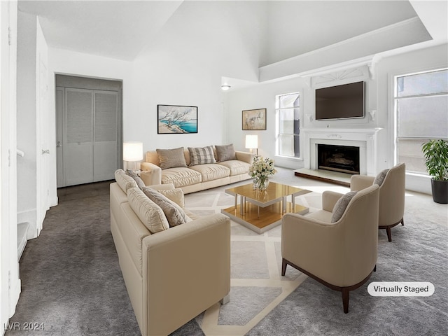 living room featuring carpet floors and high vaulted ceiling