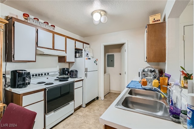 kitchen featuring a textured ceiling, white appliances, sink, and white cabinets