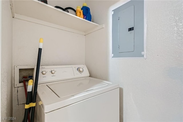 laundry room featuring washer / dryer, electric panel, and laundry area