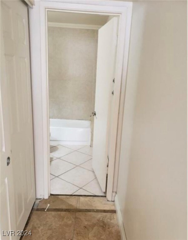 corridor with tile patterned flooring