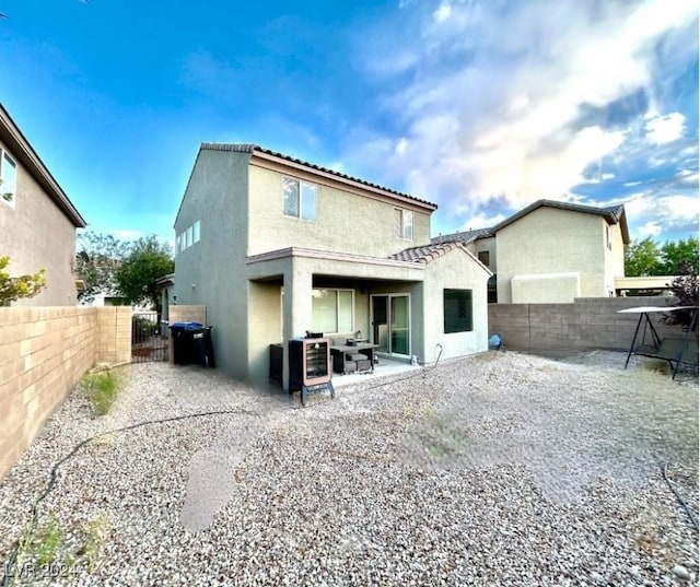 rear view of property with a patio area