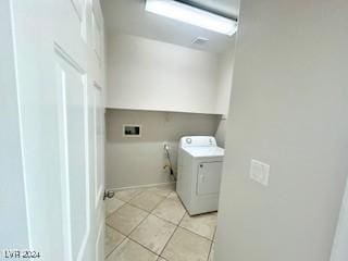 washroom featuring light tile patterned floors and washer / dryer