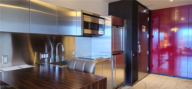 kitchen featuring stovetop and sink