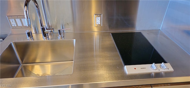 interior details featuring stovetop and sink