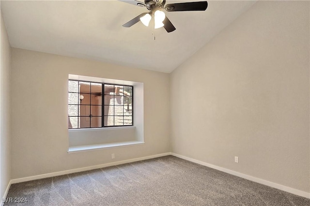 spare room with lofted ceiling, carpet flooring, and ceiling fan