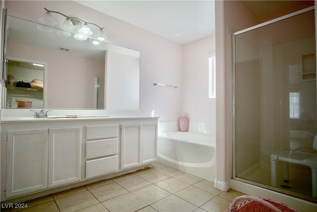 bathroom featuring shower with separate bathtub, tile patterned floors, and vanity