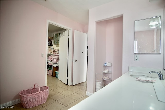 bathroom with tile patterned flooring and sink