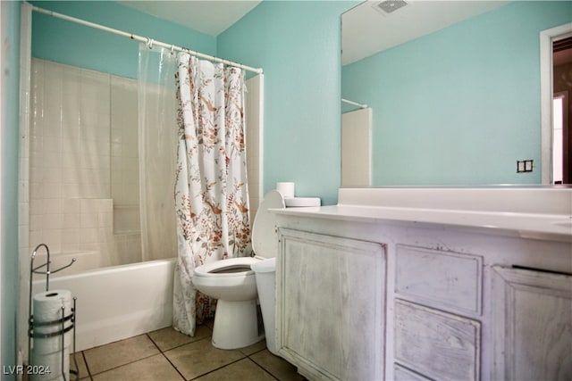 full bathroom featuring shower / bath combination with curtain, tile patterned flooring, vanity, and toilet