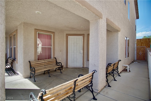 property entrance featuring a patio