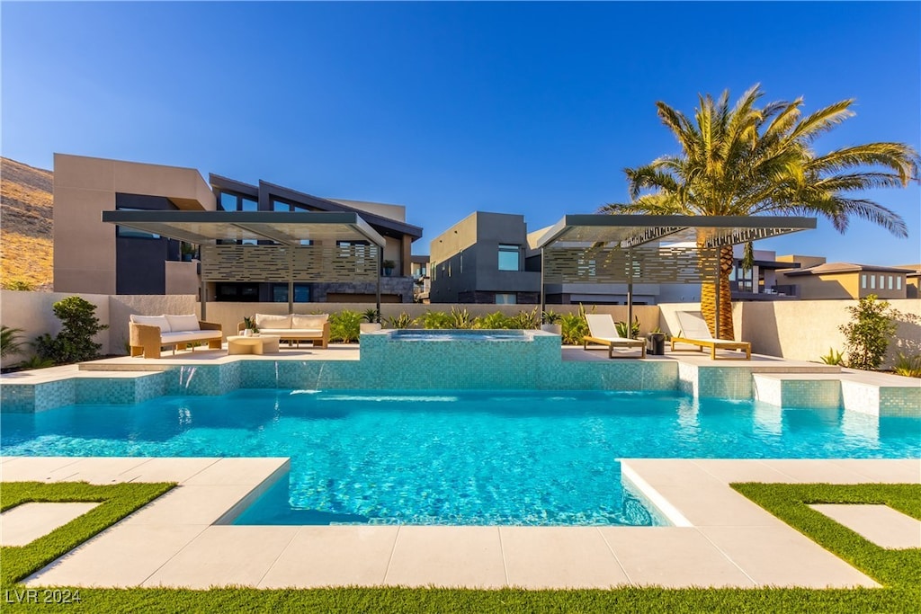 view of swimming pool with an in ground hot tub, a pergola, and a patio