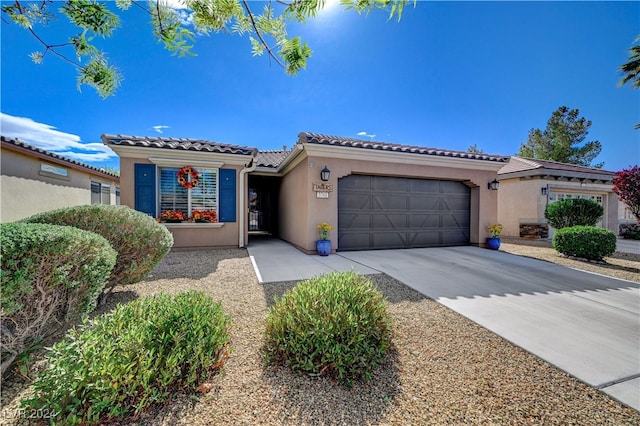 mediterranean / spanish-style house featuring a garage