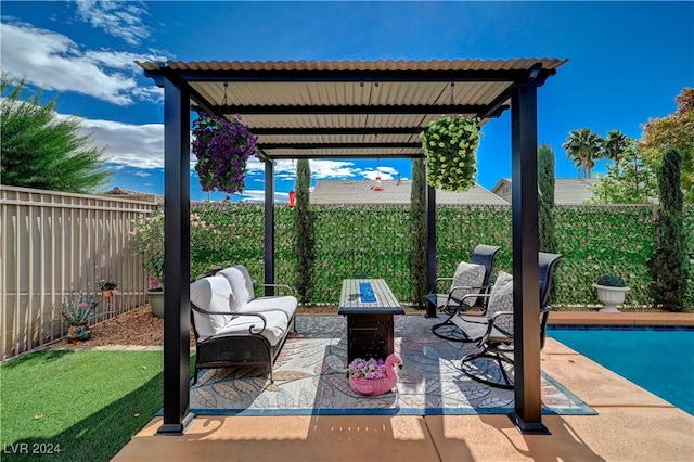 view of patio / terrace with an outdoor living space with a fire pit and a fenced in pool