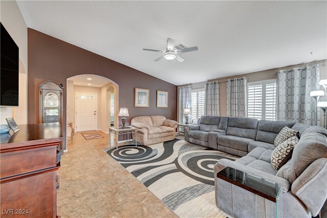 living room with ceiling fan and lofted ceiling