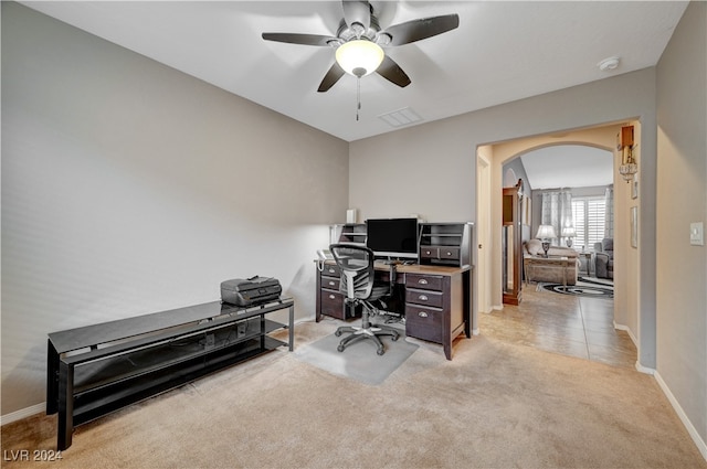 office area featuring light carpet and ceiling fan