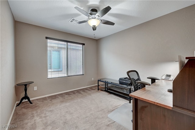 carpeted office with ceiling fan