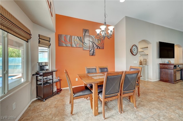 dining space with an inviting chandelier and light tile patterned floors