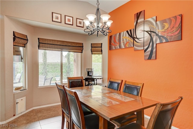 tiled dining space featuring an inviting chandelier