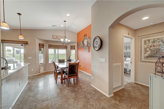 tiled dining room with lofted ceiling and a notable chandelier