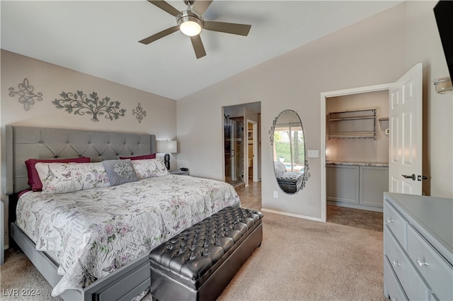 bedroom featuring light carpet, a closet, vaulted ceiling, and ceiling fan