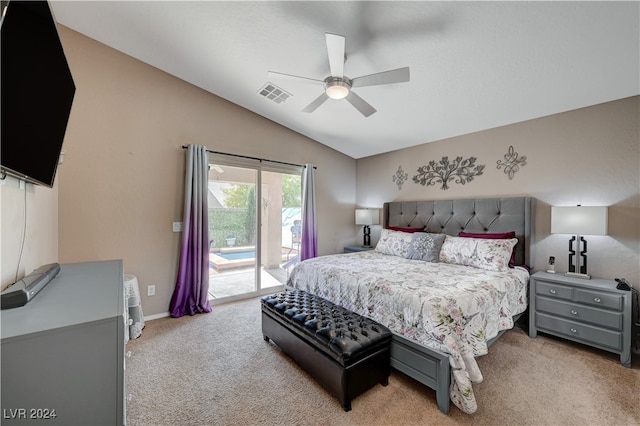 bedroom with access to exterior, light colored carpet, vaulted ceiling, and ceiling fan