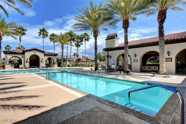 view of swimming pool with a patio area