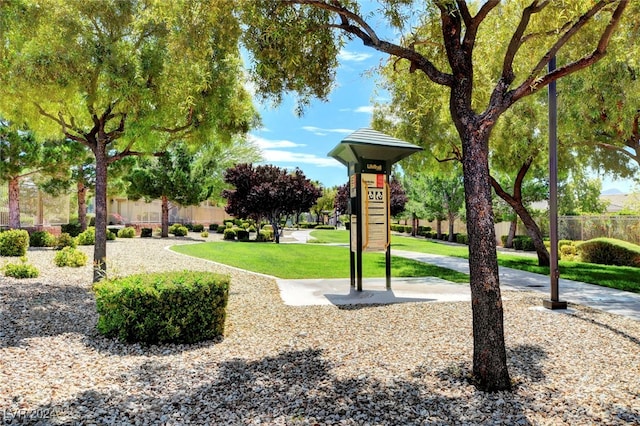 view of home's community with a lawn