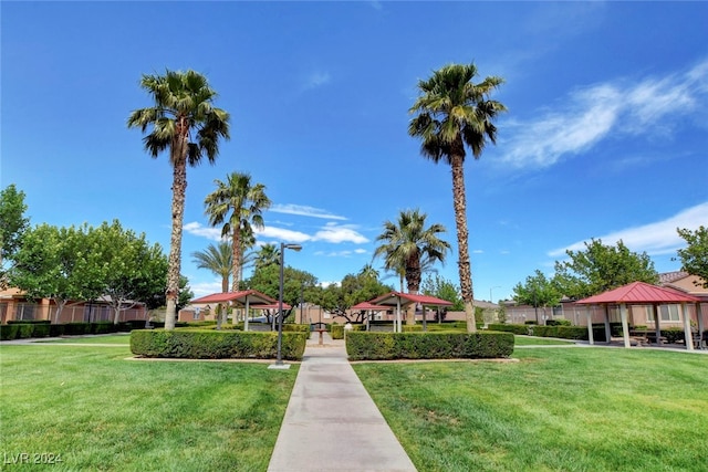 view of property's community featuring a yard and a gazebo