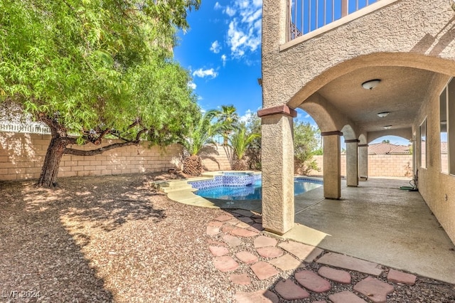 view of patio / terrace featuring a fenced backyard and a fenced in pool