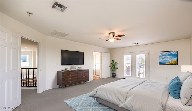 carpeted bedroom with ceiling fan, french doors, visible vents, and access to exterior