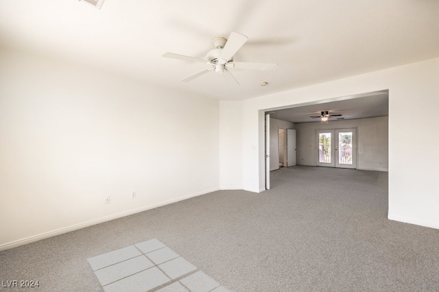 unfurnished room featuring ceiling fan, carpet floors, french doors, and baseboards