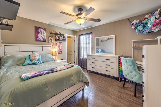 bedroom with ceiling fan and dark hardwood / wood-style floors