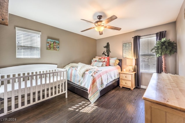 bedroom featuring ceiling fan and dark wood-type flooring