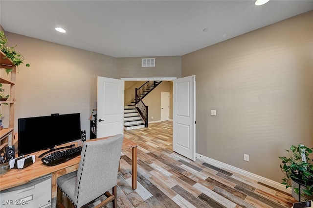 office space with light hardwood / wood-style floors