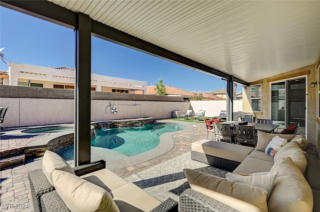 view of swimming pool featuring an in ground hot tub, an outdoor hangout area, pool water feature, and a patio area